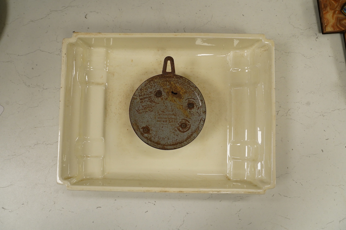 An Art Deco Jaz porcelain wall clock, 23cm high. Condition - fair, surface rust to the case of the movement, etc.